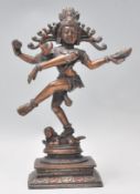 A good early 20th Century bronze figure of Shiva Nataraja God of Dance shown standing on a dwarf