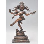 A good early 20th Century bronze figure of Shiva Nataraja God of Dance shown standing on a dwarf