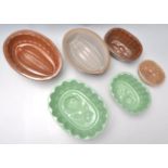 A selection of 19th Century Victorian ceramic staffordshire jelly moulds, each having impressed