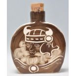 A Rushton Pottery ceramic flask having a brown and white glaze with a with a Viking man to the