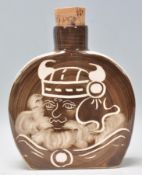 A Rushton Pottery ceramic flask having a brown and white glaze with a with a Viking man to the