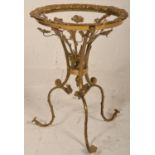 A 20th Century French occasional / side table frame having a round top raised on three scrolled legs