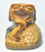 A good early 20th Century Chinese tigers eyes carved figure of a fu dog. Measures 5 cm tall by 5