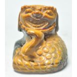 A good early 20th Century Chinese tigers eyes carved figure of a fu dog. Measures 5 cm tall by 5