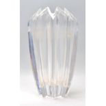 A 20th Century glass vase of faceted geometric form, having a triangular crenelated rim. Marked