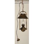 A contemporary antique style large brass hanging lantern of oil lamp type with modern electric