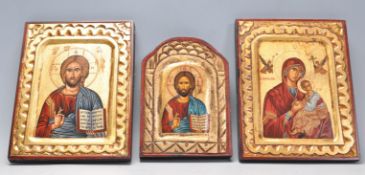 A contomary group of three antique Byzantine style icons with gilt and red borders. Each bearing
