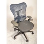 A Herman Miller Mirra 2 office desk chair in a blue and grey colourway with an adjustable mesh