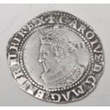 A Charles I (1625-1649) Silver Shilling having Ermine mint mark, the reverse with shield qtr and