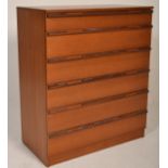 A retro 20th century teak wood Avalon chest of drawers. The upright body with a bank of six drawers