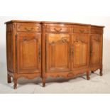 A Provincial French walnut large bow front sideboard dresser having a parquetry top with four frieze