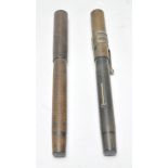 Two vintage 20th Century Blackbird self filling fountain pens. Each pen having a 14ct gold nib and