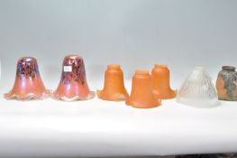 A collection of 20th century art glass lamp - light shades. To include 2 stunning art glass volcanic