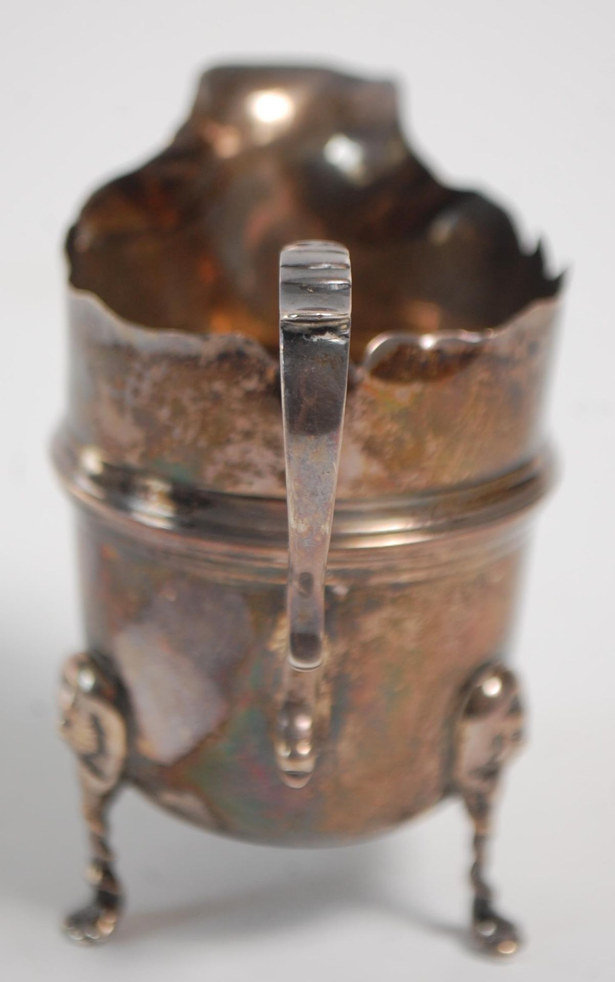 An early 20th Century silver hallmarked creamer jug having a flared top with banded center raised on - Image 6 of 9