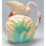 A 20th Century vintage ceramic jug in the form of a swan, the neck modelled into a handle having