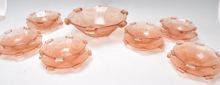 A set of six early 20th Century Art Deco pink frosted glass fruit bowls and plates together with