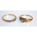 A hallmarked 9ct yellow gold ring set with five green stones. Hallmarked for Birmingham date