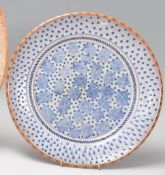 Morgen Hall - a studio art pottery plate tin glazed in blue and white, hand painted with geometric