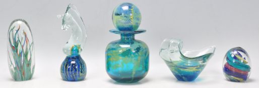 A collection of studio art glass to include a Mdina bottle having a cylindrical body, flared rim and
