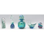 A collection of studio art glass to include a Mdina bottle having a cylindrical body, flared rim and