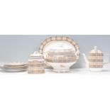 A Burberry pattern part dinner service to include turreen, plates, tea pot, sugar pot and platter,