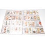 A collection of cigarette cards to include five full sets; Wills Lucky Charms, Household Hints,