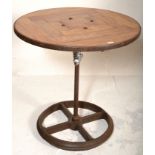 A good 20th century upcycled Industrial cafe table. Raised on Industrial trolley - tram wheel base