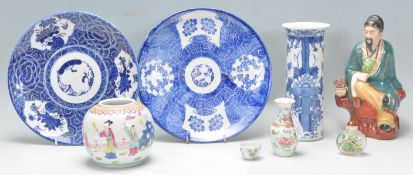 A mixed group of Chinese ceramics dating from the late 19th Century to include a blue and white vase