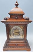 Junghans - A good 19th Century Victorian oak cased mantel clock having a decorative carved case with