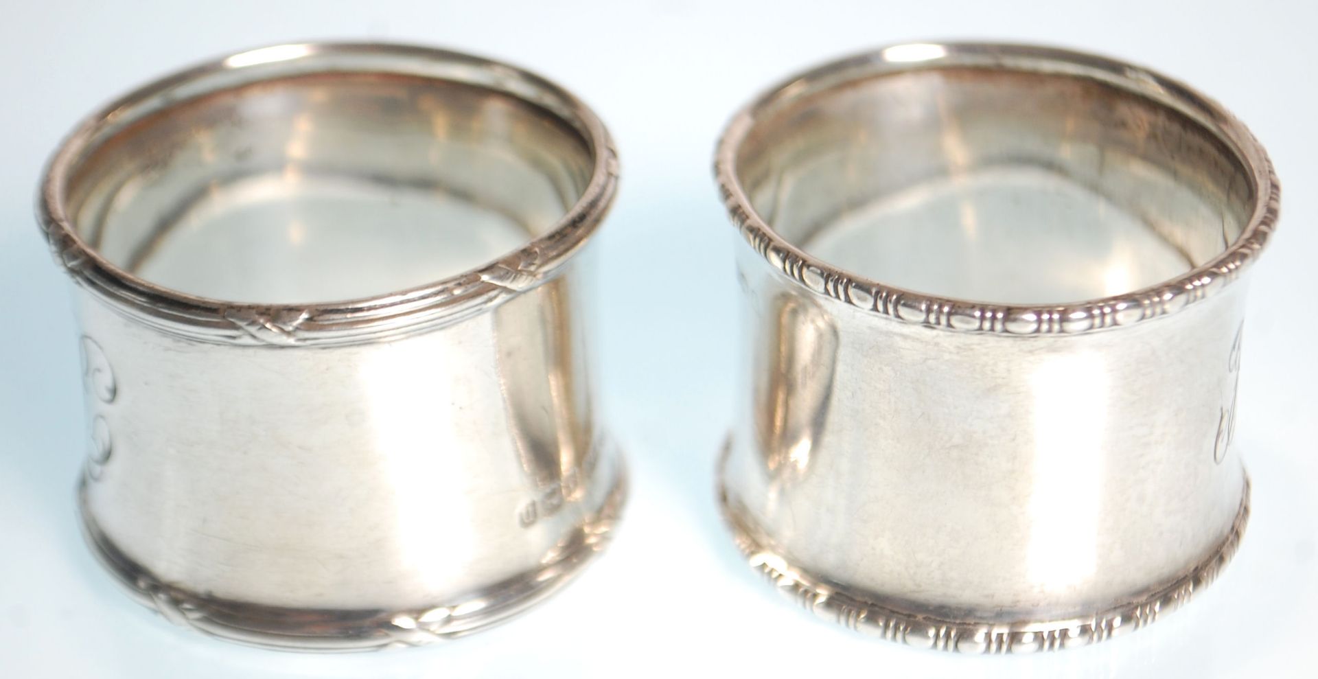 Two silver hallmarked napkin rings to include one with gadrooned borders and engraved initials to - Image 2 of 6