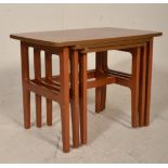 A set of vintage retro mid 20th Century Schreiber teak wood nest of graduating tables raised rounded
