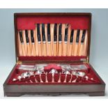 A vintage 20th Century oak cased canteen of cutlery housing a full set of Viceroy Silver Plate
