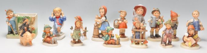 A collection of Goebel Hummel figurines to include sixteen figures all marked Goebel to the bases.