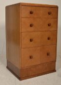 An early 20th Century 1930's Art Deco walnut upright chest of drawers consisting of of four