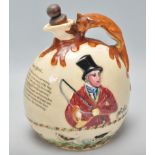 An early 20th Century Crown Devon ceramic John Peel musical flagon flask / decanter having a moulded