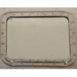 A fantastic 20th Century white brass porthole style mirror of rectangular form.