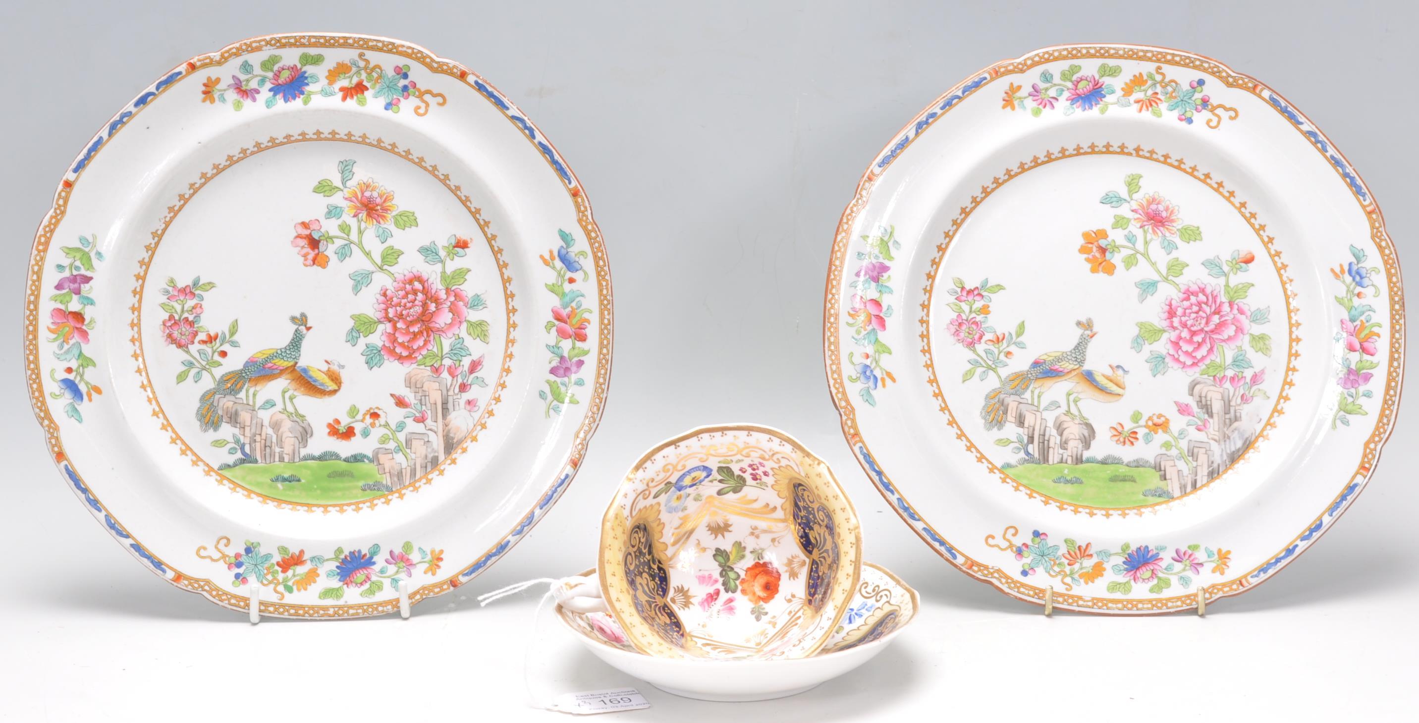 A stunning 19th Century cabinet cup and saucer in the manner of Coalport, with decorative hand