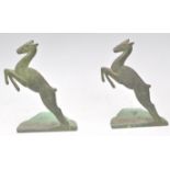 A pair of unusual early 20th century brass / bronze bookends in the form of leaping gazelle set to