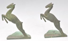 A pair of unusual early 20th century brass / bronze bookends in the form of leaping gazelle set to