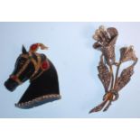 Two vintage mid Century fashion brooches to include a horse brooch set with green, red and white