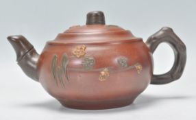 A Chinese Yixing teapot having bamboo style handle