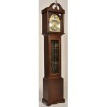 A 20th century mahogany cased Tempus Fugit Longcase clock. Mahogany case with glass fronted hood