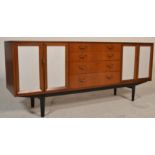 A retro mid century Nathan furniture teak wood sideboard / credenza. Raised on ebonised tapering