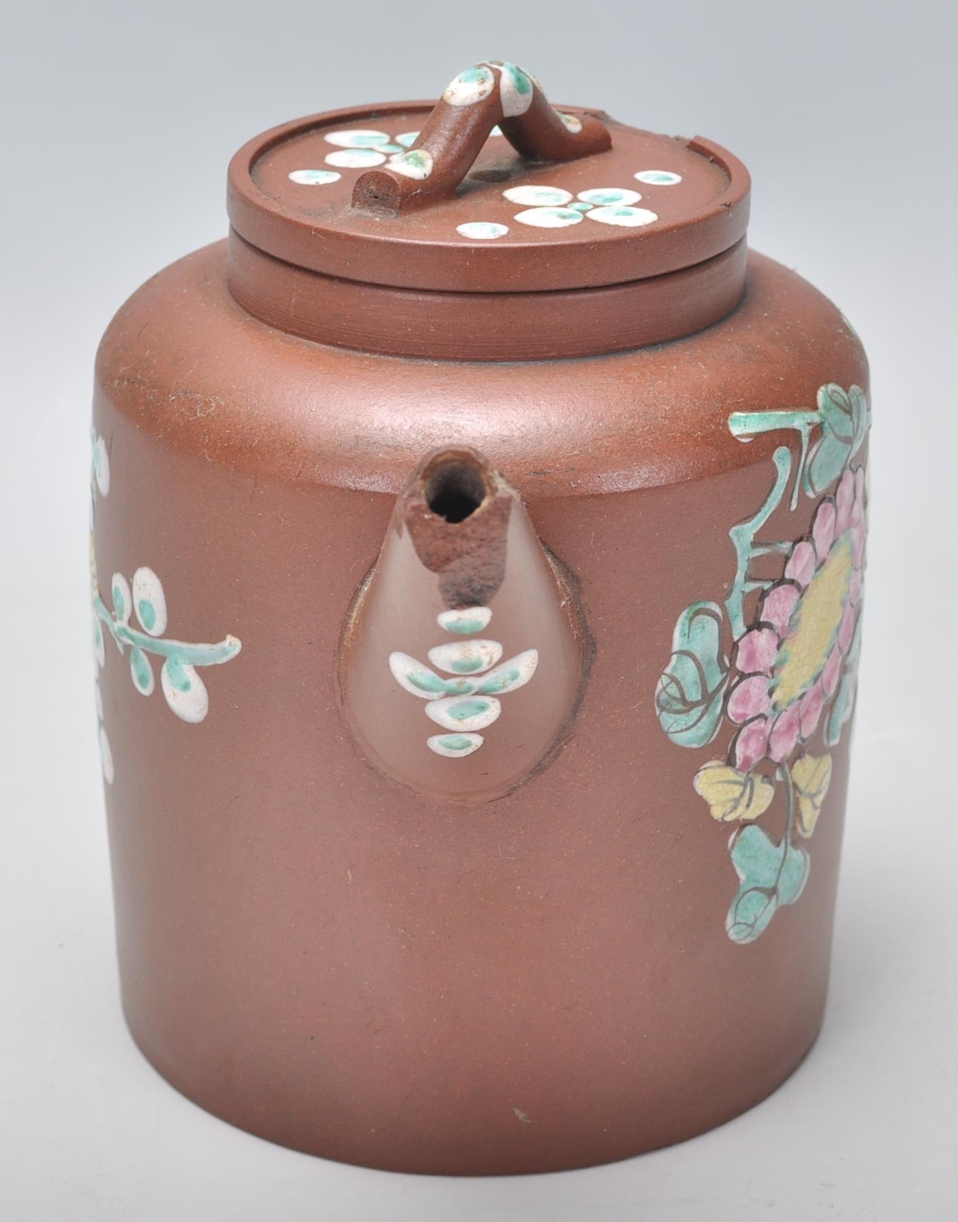 An early 20th Century Chinese brown clay teapot having hand enameled bird and floral decoration with - Image 4 of 8