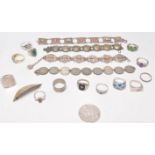 A collection of silver rings and other silver and white metal items of jewellery to include many