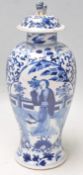 A 19th Century Chinese porcelain lidded baluster vase being painted with blue and white having a