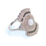 A stamped 925 silver art deco style panel ring set with a central round cut opal and white and black