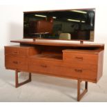 A vintage retro 20th Century teak wood dressing table chest having large rectangular mirror back