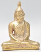 A Tibetan bronze figure of Bodhisattva Buddha seated in the lotus position wearing robes with carved