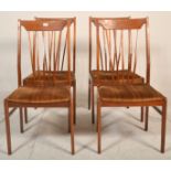 A set of 4 retro mid century teak wood Danish influence dining chairs. Raised on tapering legs